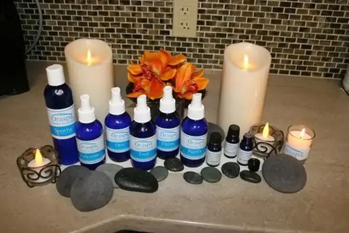 Aromatherapy oils, candles and hot stones on the Oraspa tray