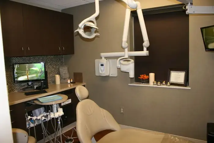 A treatment room with a chairside monitor