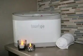 The towel warmer and candles in the Oraspa room